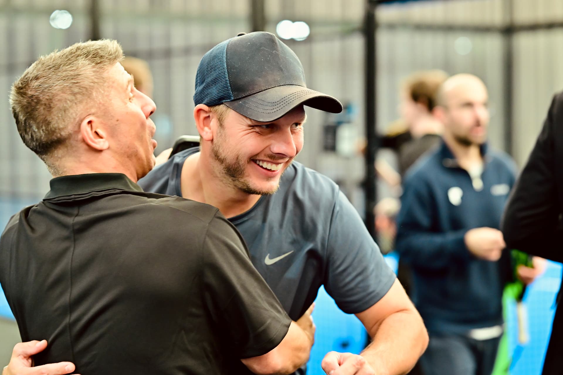 Two members embracing after a hard-fought match